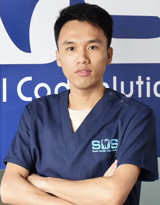 Mr. Huang, technical supervisor reviewing dental CAD design standards and quality